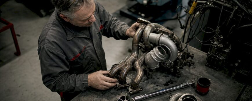 Engineer working on turbo exhaust manifold