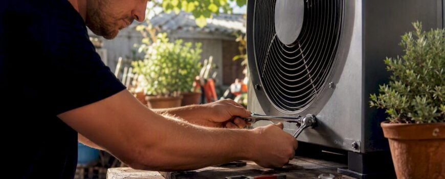 Technician assembling industrial HVAC fan