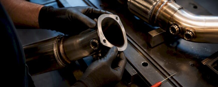 Technician checking exhaust sensor fitment