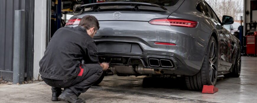 Mercedes-AMG GT exhaust inspection outside garage