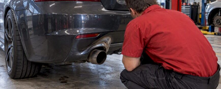 Melted rear bumper beside misaligned exhaust tip