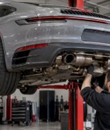 Porsche 911 raised for exhaust inspection